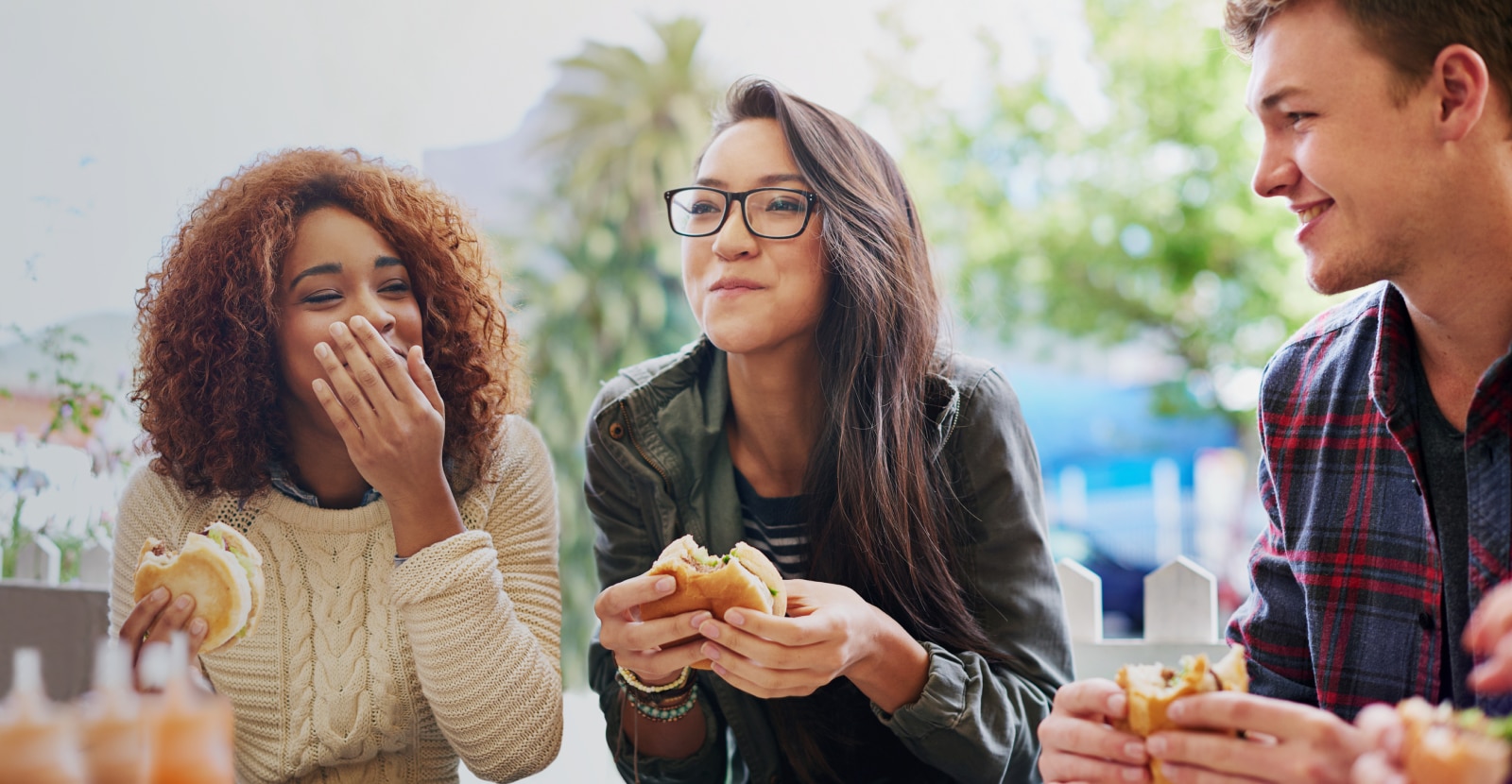 friends eating burger together